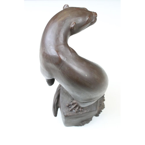 2 - Meissen Bottger Steinzeug red stoneware otter modelled perched on a rock. Impressed marks to base wi... 