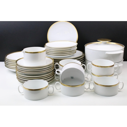 24 - Thomas Medaillon thick gold band dinner service set to include double lipped sauce boat, eight soup ... 