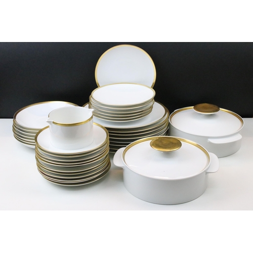 24 - Thomas Medaillon thick gold band dinner service set to include double lipped sauce boat, eight soup ... 