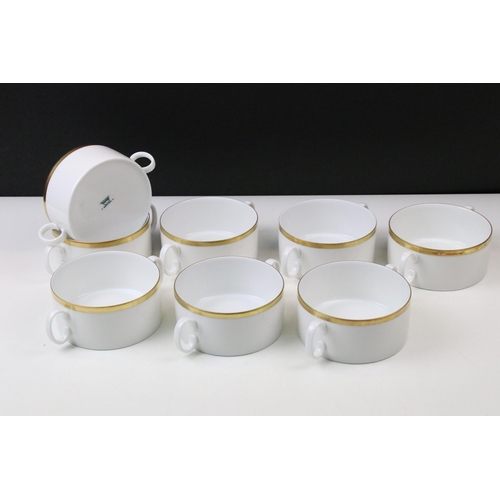 24 - Thomas Medaillon thick gold band dinner service set to include double lipped sauce boat, eight soup ... 