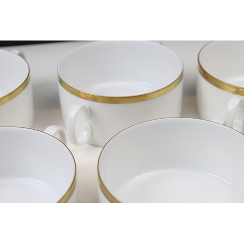 24 - Thomas Medaillon thick gold band dinner service set to include double lipped sauce boat, eight soup ... 