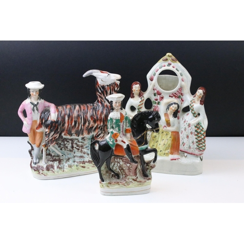 28 - Set of three Staffordshire flat back figures to include three graces pocket watch holder, goat spill... 