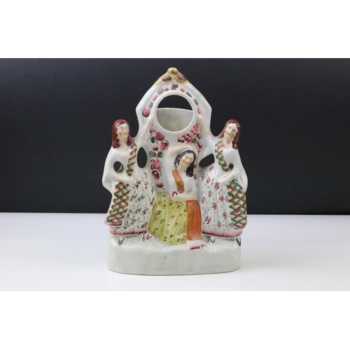 28 - Set of three Staffordshire flat back figures to include three graces pocket watch holder, goat spill... 