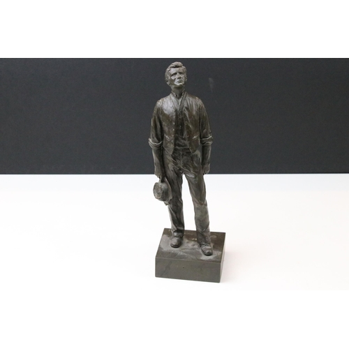 37 - Group of cast sculptures to include a bronze Peter Hicks limited edition of a gentleman on an integr... 