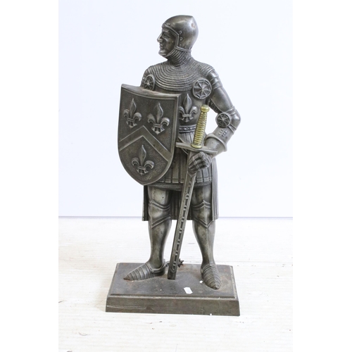 373A - Cast metal fire companion modelled as a knight in armour with poker sword, raised upon stepped recta... 