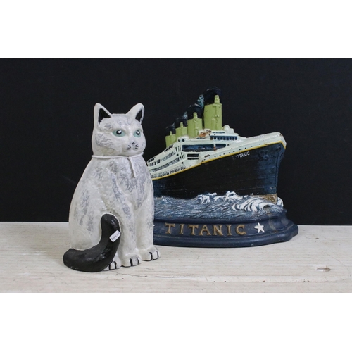 376 - Cast iron painted Titanic ship and cat door stops