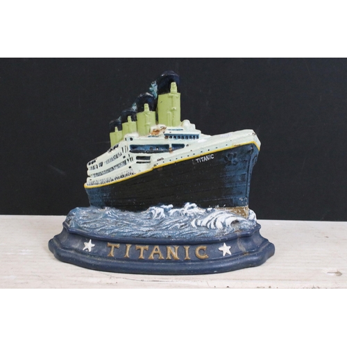 376 - Cast iron painted Titanic ship and cat door stops