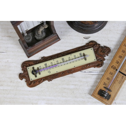 383 - Four antique wooden thermometers, free standing and wall hanging, to include makers Hy Robinson, Arc... 