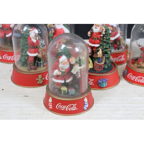 386 - Collection of vintage limited edition Coca Cola Santa glass dome figurines to include 'The pause tha... 