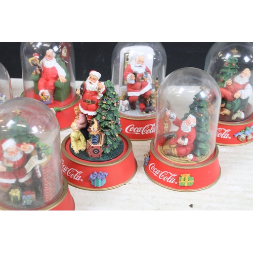 386 - Collection of vintage limited edition Coca Cola Santa glass dome figurines to include 'The pause tha... 