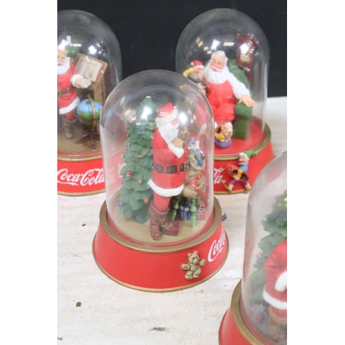 386 - Collection of vintage limited edition Coca Cola Santa glass dome figurines to include 'The pause tha... 