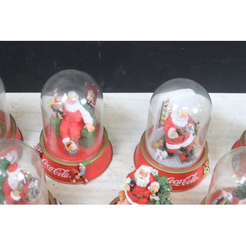 386 - Collection of vintage limited edition Coca Cola Santa glass dome figurines to include 'The pause tha... 