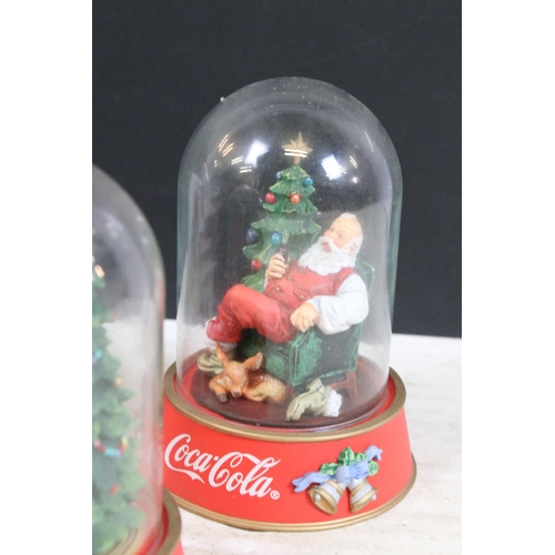 386 - Collection of vintage limited edition Coca Cola Santa glass dome figurines to include 'The pause tha... 