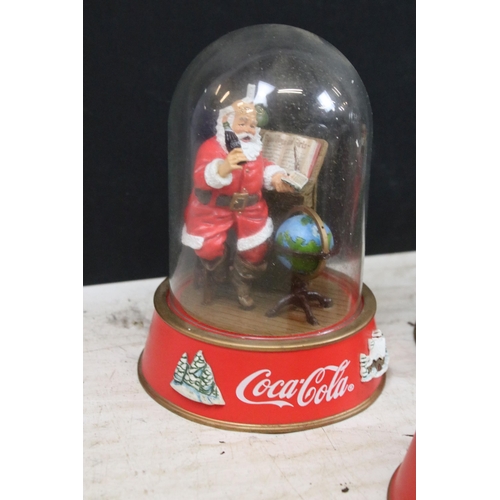 386 - Collection of vintage limited edition Coca Cola Santa glass dome figurines to include 'The pause tha... 