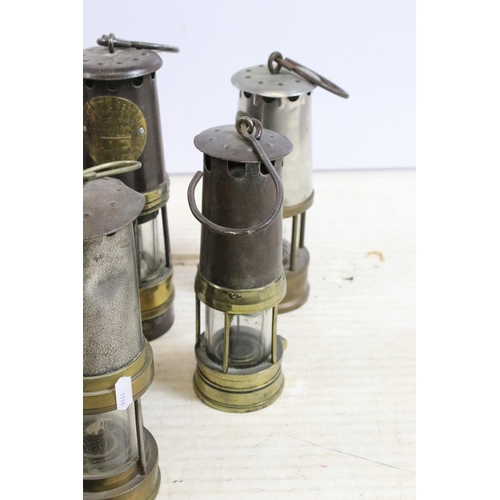 390 - Quantity of miners safety lamp lanterns to include makers Eccles 'The Protector', Ackroyd & Best tog... 