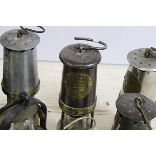 390 - Quantity of miners safety lamp lanterns to include makers Eccles 'The Protector', Ackroyd & Best tog... 