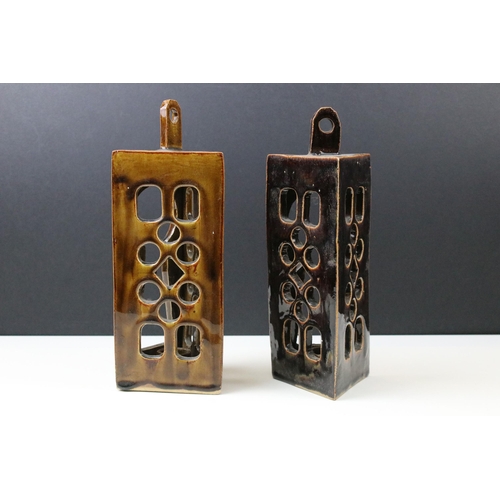 42 - Pair of hand made rustic studio pottery candle holder sconces with key hole design opening, H 26cm