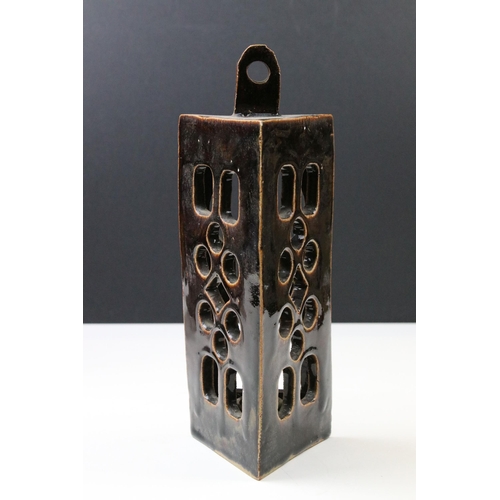 42 - Pair of hand made rustic studio pottery candle holder sconces with key hole design opening, H 26cm