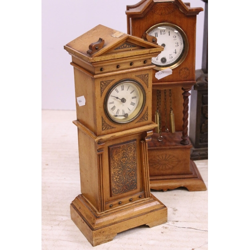 448 - Assortment of clocks to include an Art Deco wooden example together with a Napoleon hat carved wood ... 