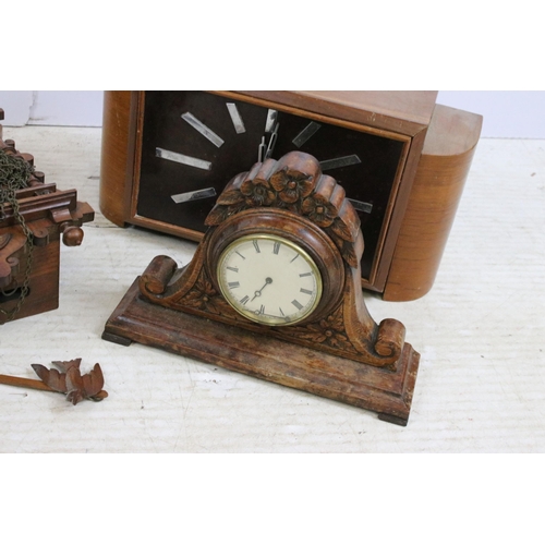 448 - Assortment of clocks to include an Art Deco wooden example together with a Napoleon hat carved wood ... 