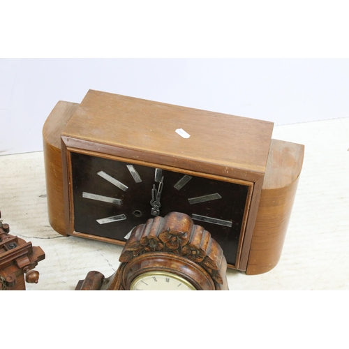 448 - Assortment of clocks to include an Art Deco wooden example together with a Napoleon hat carved wood ... 