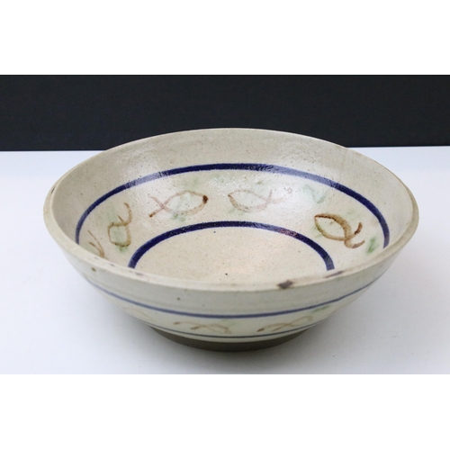 51 - Sidney Tustin at Winchcombe Pottery green glazed bowl, 21cm diameter and a signed studio pottery bow... 