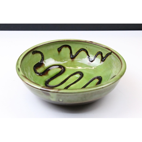 51 - Sidney Tustin at Winchcombe Pottery green glazed bowl, 21cm diameter and a signed studio pottery bow... 