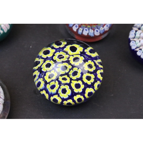 52 - Collection of thirteen millefiori design glass paperweights of mixed shapes and sizes