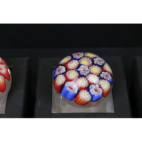 52 - Collection of thirteen millefiori design glass paperweights of mixed shapes and sizes