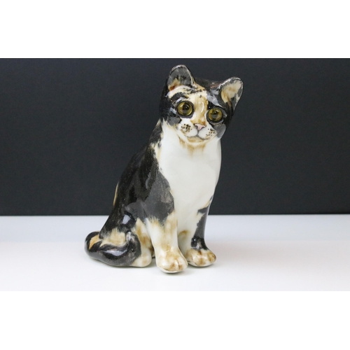 6 - Pair of Winstanley forward facing tortoiseshell cat figurines with yellow glass eyes, signed to base... 