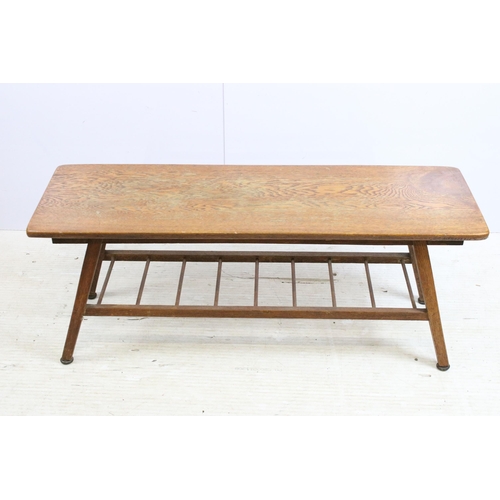 615 - Mid century oak coffee table, the rectangular top above spindled undertier on splayed legs, 39cm hig... 