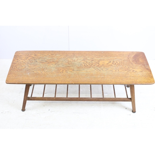 615 - Mid century oak coffee table, the rectangular top above spindled undertier on splayed legs, 39cm hig... 