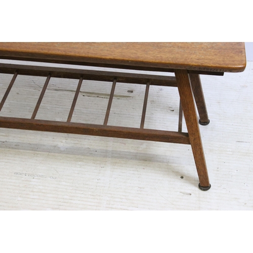 615 - Mid century oak coffee table, the rectangular top above spindled undertier on splayed legs, 39cm hig... 