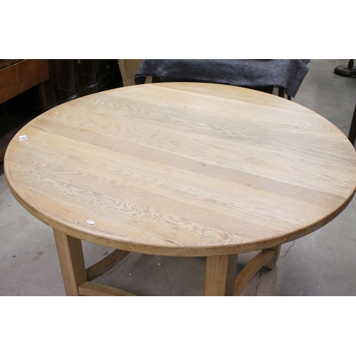 616 - Neptune oak circular dining table with square tapering legs and shaped stretchered supports, 73cm hi... 