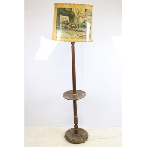 629 - 20th century turned mahogany floor standing lamp with circular centre shelf and hand painted decorat... 