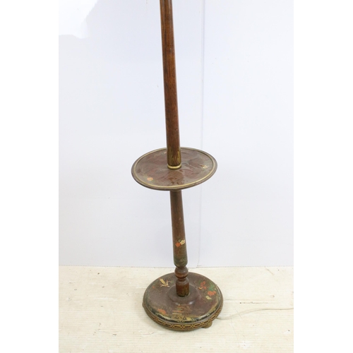 629 - 20th century turned mahogany floor standing lamp with circular centre shelf and hand painted decorat... 