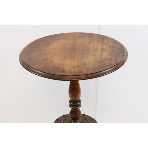 630 - 19th Century mahogany pedestal table having a round top with turned column raised on three scrolled ... 