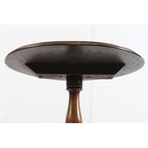 630 - 19th Century mahogany pedestal table having a round top with turned column raised on three scrolled ... 