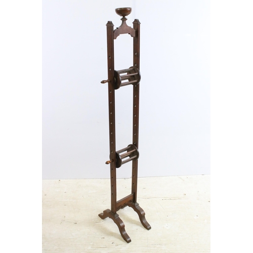 631 - 19th century mahogany adjustable wool winder with carved scroll detail, H 113cm together with a dark... 