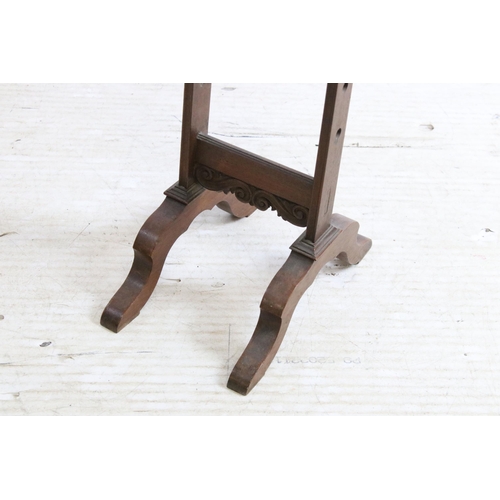 631 - 19th century mahogany adjustable wool winder with carved scroll detail, H 113cm together with a dark... 