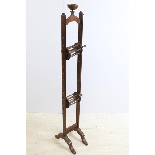 631 - 19th century mahogany adjustable wool winder with carved scroll detail, H 113cm together with a dark... 