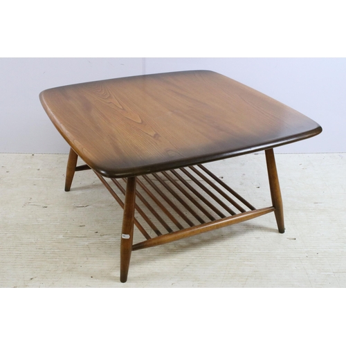 633 - Ercol Windsor model 767 square coffee table, the shaped square top above  spindled undertier, label ... 