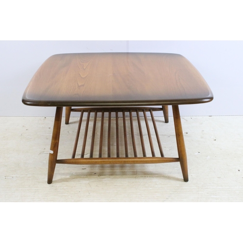 633 - Ercol Windsor model 767 square coffee table, the shaped square top above  spindled undertier, label ... 