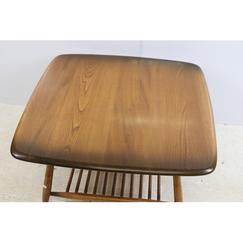 633 - Ercol Windsor model 767 square coffee table, the shaped square top above  spindled undertier, label ... 