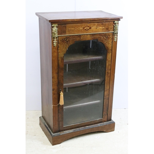 634 - Edwardian walnut and rosewood inlaid music / drinks cabinet, with single glazed door flanked by gilt... 