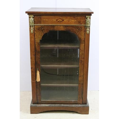 634 - Edwardian walnut and rosewood inlaid music / drinks cabinet, with single glazed door flanked by gilt... 