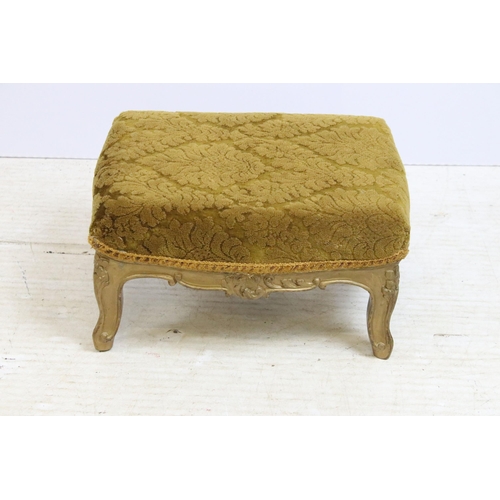 637 - 20th century upholstered foot rest stool with carved wood cabriole leg base in painted gold, H 20cm,... 