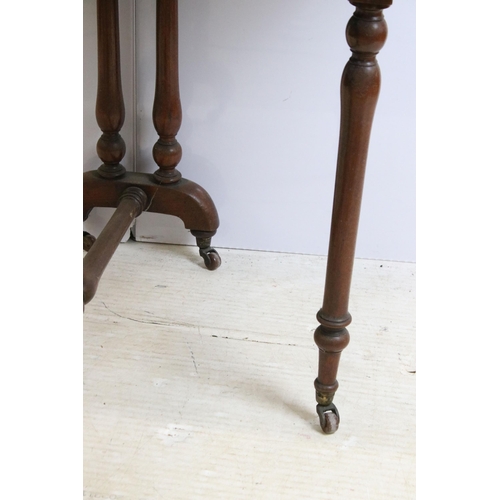 638 - Mahogany folding gateleg table on original casters with twin flaps, H 72cm