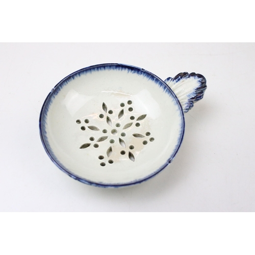 7 - 19th Century pearlware strainer with a moulded leaf handle together with an 18th Century English por... 