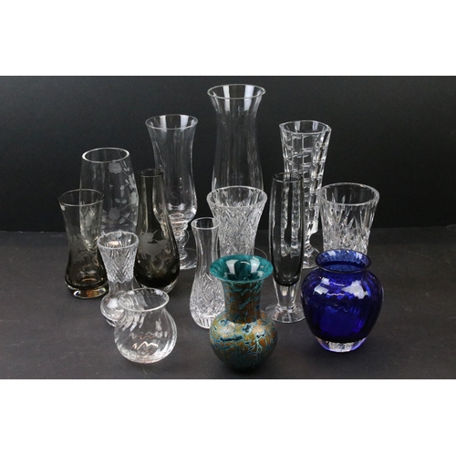 74 - Mixed collection of glass vases in varying forms and designs to include Dartington examples